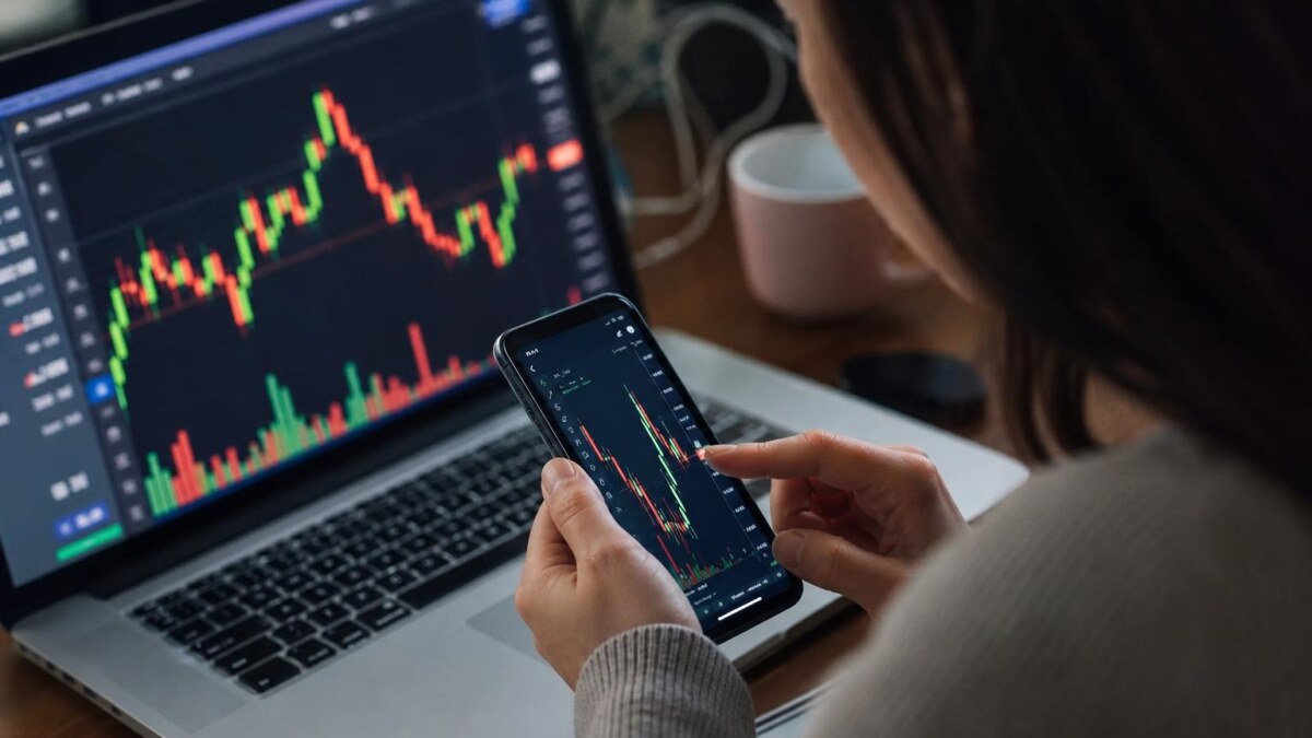 Person viewing financial charts
